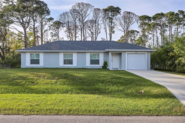 ranch-style home featuring a garage and a front lawn