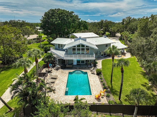 view of pool with a yard and a patio area