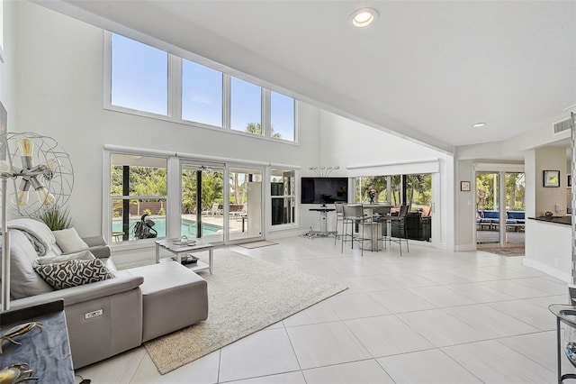 living room featuring a healthy amount of sunlight and light tile patterned floors