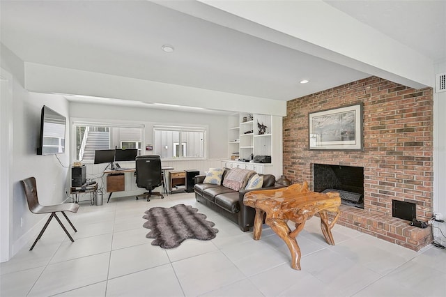 living room featuring a fireplace and light tile patterned flooring