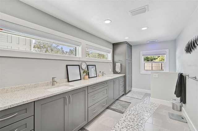 bathroom with vanity and tile patterned flooring