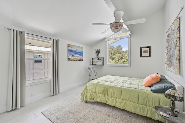 bedroom featuring lofted ceiling, light tile patterned flooring, and ceiling fan