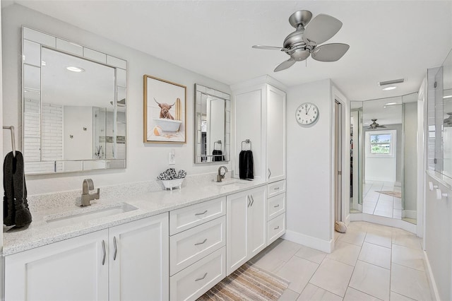 bathroom featuring vanity, an enclosed shower, ceiling fan, and tile patterned flooring