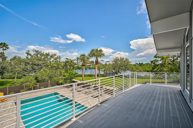 deck with a water view and a pool