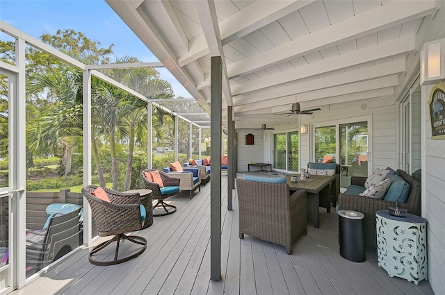 deck with outdoor lounge area and ceiling fan