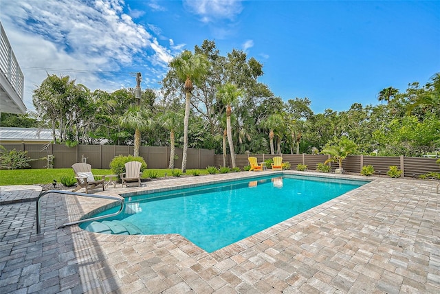 view of swimming pool with a patio