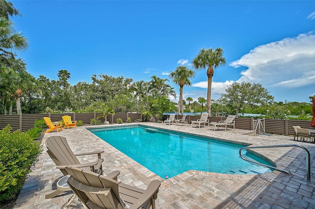 view of swimming pool with a patio