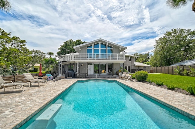 view of swimming pool with area for grilling and a patio area