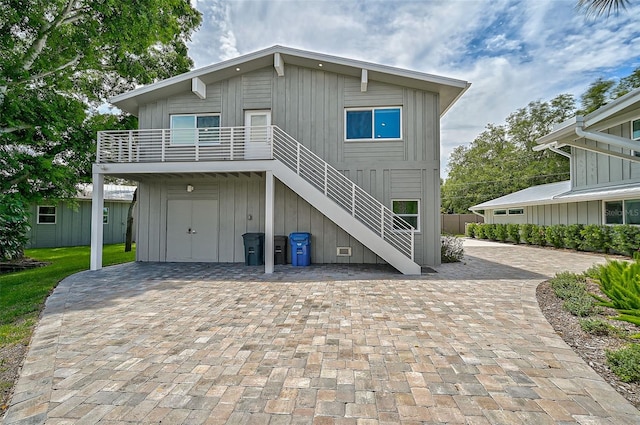 back of property featuring a storage shed