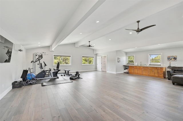 exercise area with light wood-type flooring, ceiling fan, lofted ceiling, and a wall mounted air conditioner