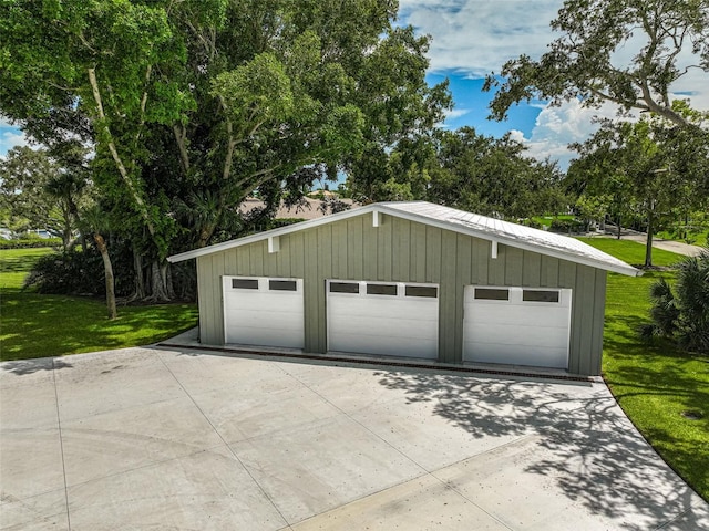 garage featuring a yard