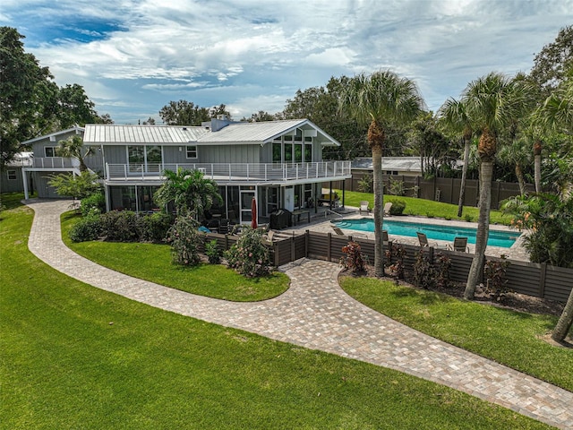 view of pool with a yard and a patio area