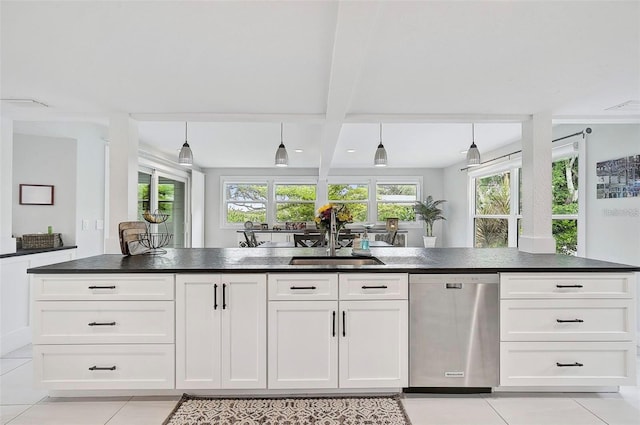 kitchen with beamed ceiling, light tile patterned floors, dishwasher, sink, and white cabinets