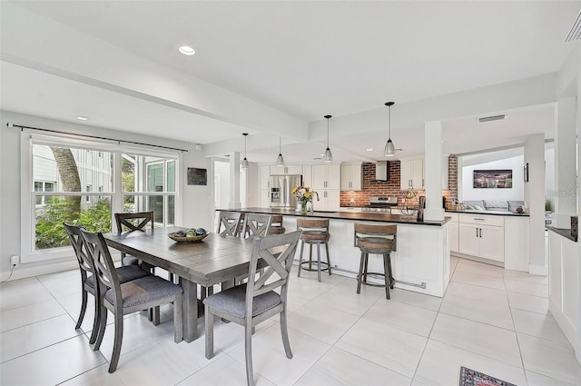 dining area with light tile patterned flooring