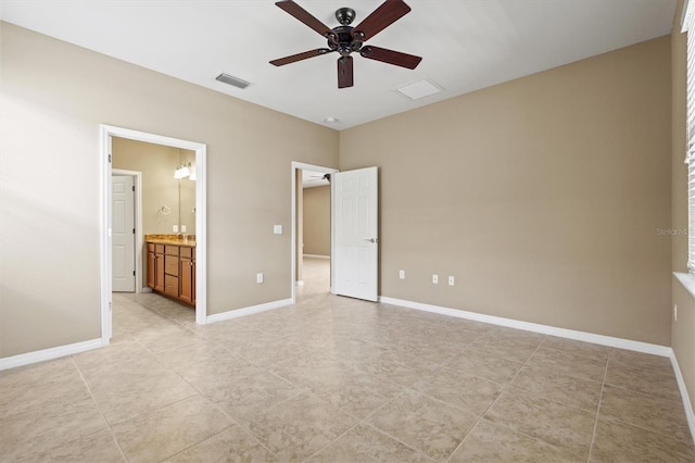 unfurnished bedroom with ceiling fan and connected bathroom