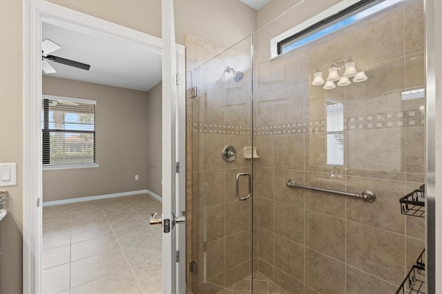 bathroom featuring tile patterned floors, ceiling fan, and an enclosed shower