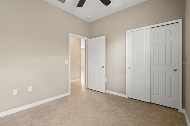 unfurnished bedroom featuring ceiling fan, light tile patterned flooring, and a closet