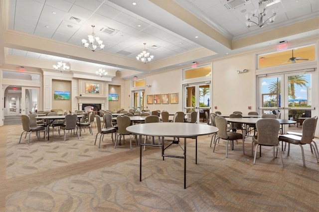 carpeted dining area featuring ceiling fan, french doors, and ornamental molding