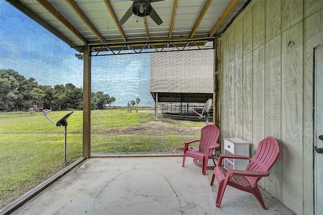 exterior space featuring ceiling fan