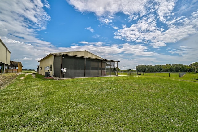 view of yard featuring a sunroom