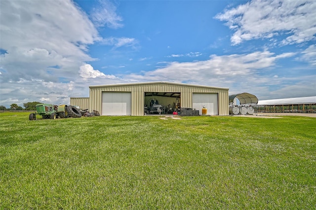 view of outbuilding with a garage and a lawn