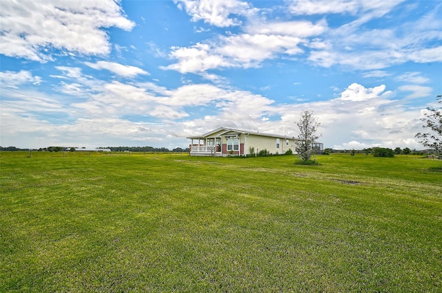 view of yard with a rural view