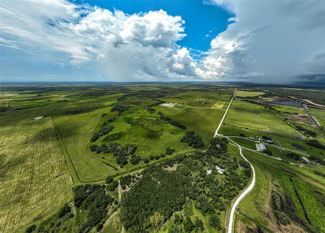 birds eye view of property with a rural view