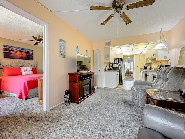 carpeted living room featuring a textured ceiling and ceiling fan