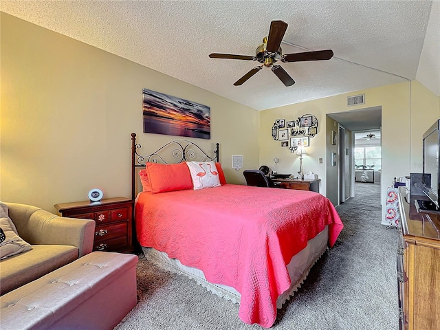 bedroom with a textured ceiling, dark colored carpet, and ceiling fan