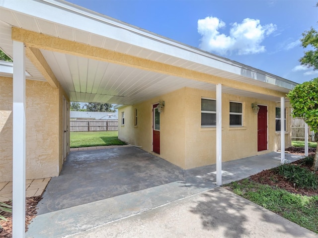 exterior space with a carport