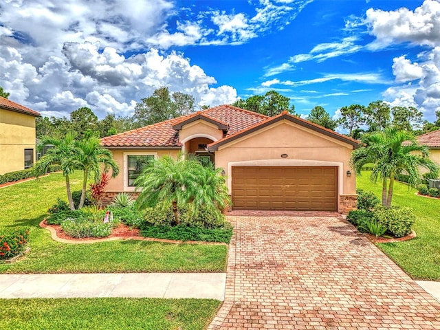 mediterranean / spanish-style house with a garage and a front lawn