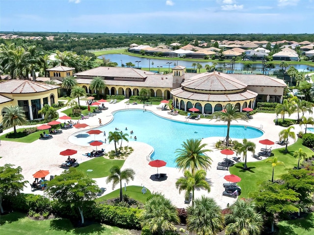 view of pool featuring a water view, a gazebo, and a patio