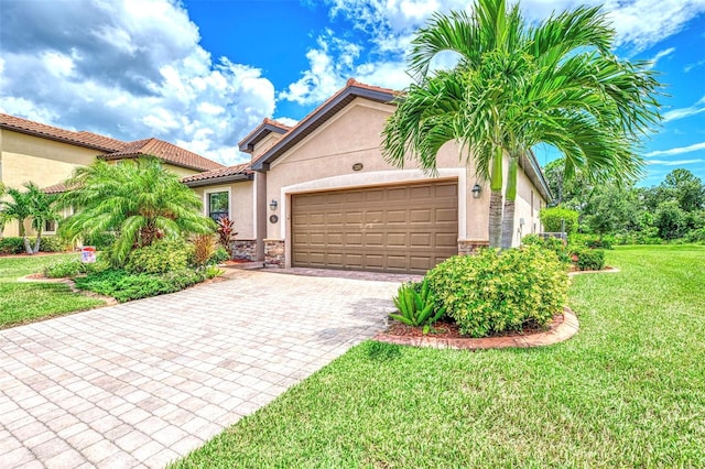 view of front of house with a garage and a front lawn