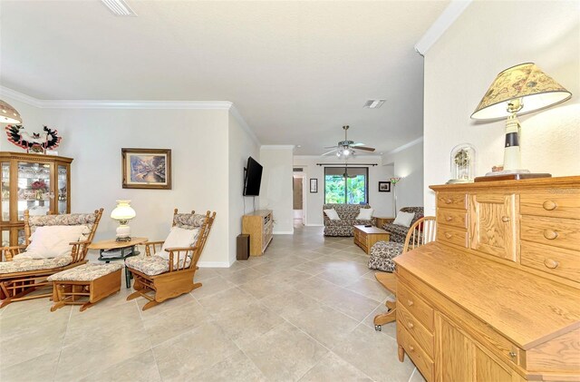 interior space featuring crown molding and ceiling fan