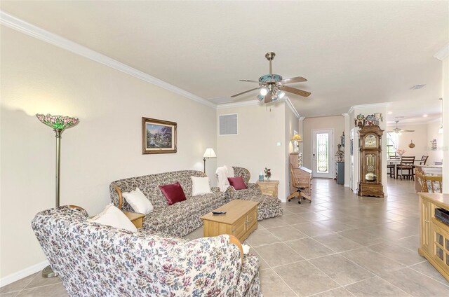 tiled living room featuring crown molding and ceiling fan