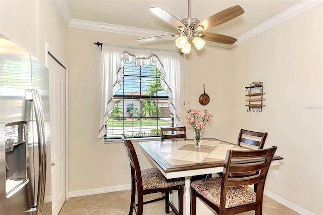 dining space featuring ornamental molding, light tile patterned flooring, and ceiling fan