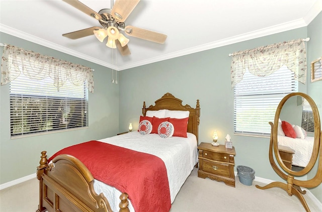 bedroom with crown molding, light colored carpet, and ceiling fan