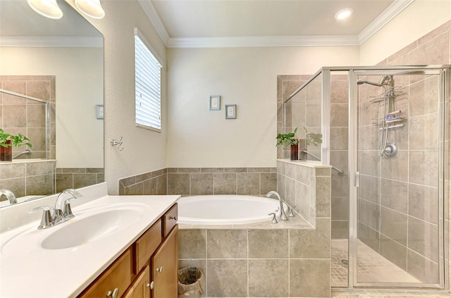 bathroom featuring vanity, ornamental molding, and shower with separate bathtub