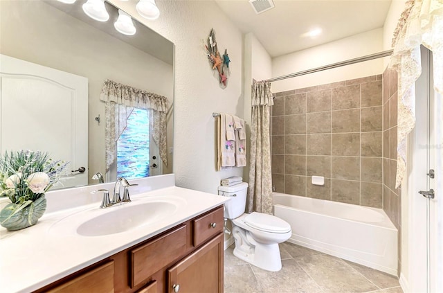 full bathroom with vanity, toilet, tile patterned floors, and shower / bath combo with shower curtain