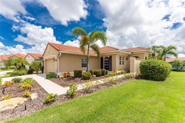 view of front of house with a garage and a front yard