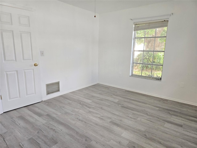 spare room with light wood-type flooring