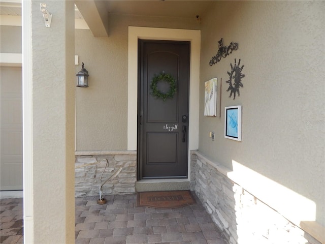 property entrance with a garage