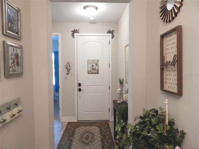 entryway with tile patterned floors