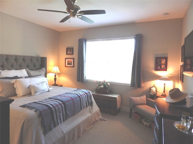 bedroom with ceiling fan and carpet floors