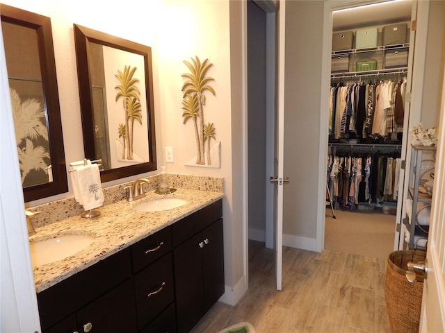 bathroom featuring vanity and hardwood / wood-style flooring