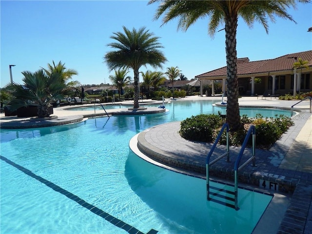 view of swimming pool featuring a patio area