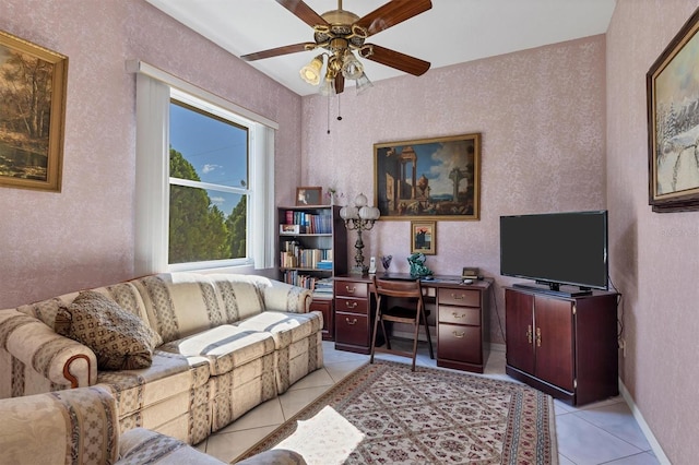 living room with ceiling fan and light tile patterned floors