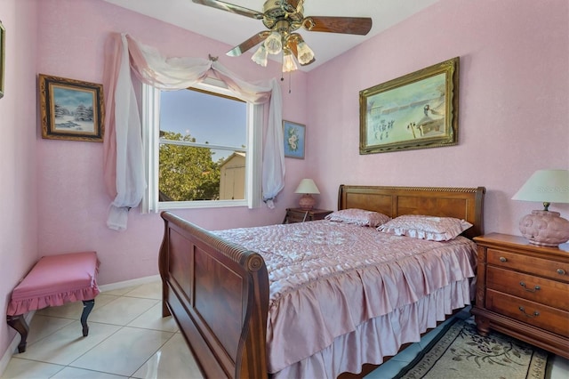 bedroom with ceiling fan and light tile patterned flooring