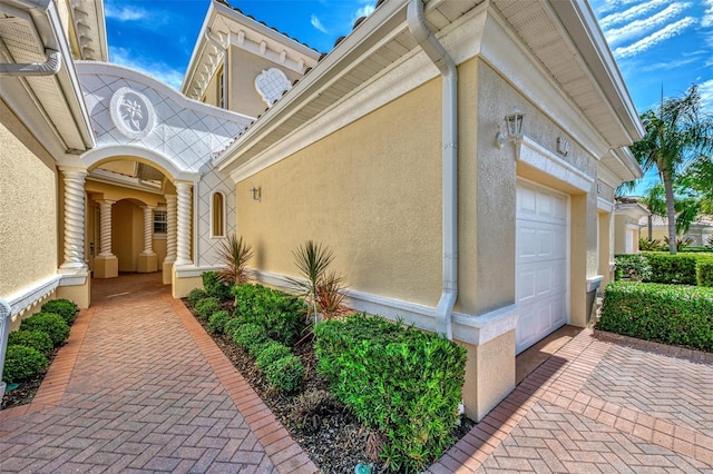 view of exterior entry featuring a garage