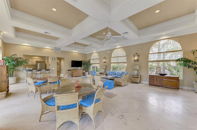 dining area featuring coffered ceiling, beamed ceiling, a high ceiling, crown molding, and ceiling fan